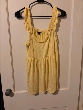 Torrid yellow sleeveless peplum top
